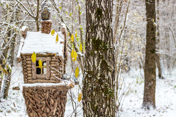 Sculpture of a hut in a winter park
