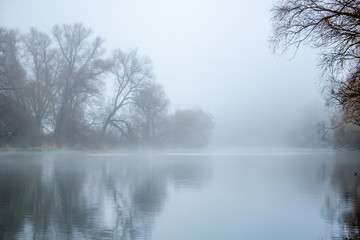 Naklejka na ściany i meble Morning mist on the river 