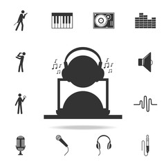 man listening music with headphones and a laptop icon. Detailed set of music icons. Premium quality graphic design. One of the collection icons for websites; web design; mobile app