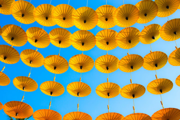 Pattern Yellow umbrellas on blue sky.