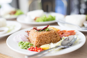 Salty brown fried Thai fried rice with assorted sweet pork and vegetable