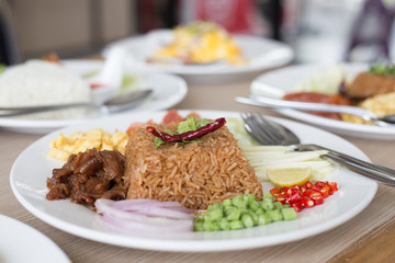 Salty brown fried Thai fried rice with assorted sweet pork and vegetable