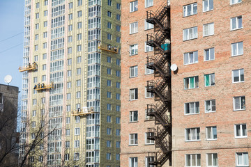Fototapeta premium Exterior Work on Unfinished Apartment Block