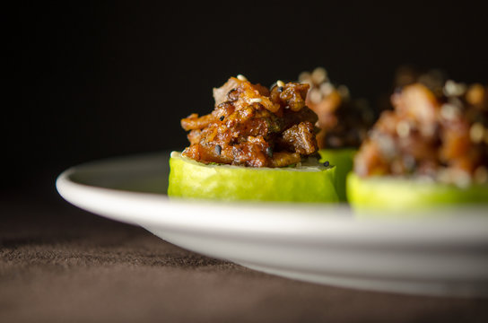 Sushi rolls in white plate and dark background