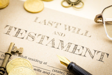 Close up Vintage of Black pen, Gold coins money, Vintage gold key and vintage clock on Last will...
