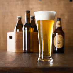 Craft beer glass on wooden table
