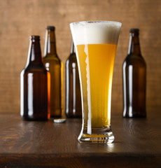 Craft beer glass on wooden table