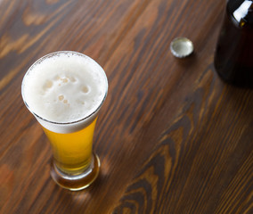 Craft beer glass on wooden table