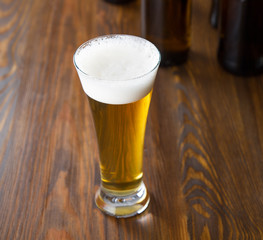 Craft beer glass on wooden table