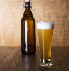 Craft beer glass on wooden table