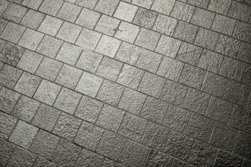 Gray tiled cement flooring for outdoor patio backyard design.