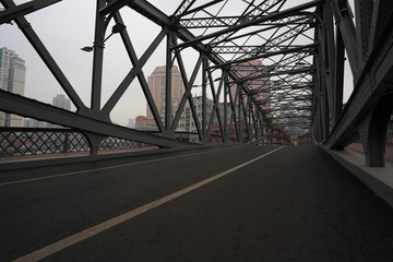 Fototapeta na wymiar Empty road floor surface with ironbridge