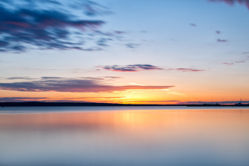 Fototapeta na wymiar Dawn over the water. Horizon.