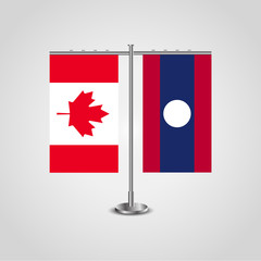 Table stand with flags of Canada and Laos.Two flag. Flag pole. Symbolizing the cooperation between the two countries. Table flags