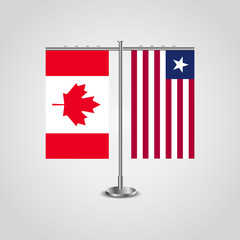 Table stand with flags of Canada and Liberia.Two flag. Flag pole. Symbolizing the cooperation between the two countries. Table flags