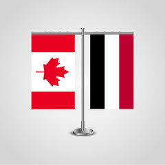 Table stand with flags of Canada and Yemen.Two flag. Flag pole. Symbolizing the cooperation between the two countries. Table flags