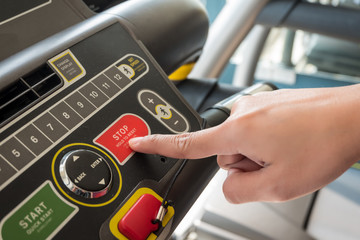 Close up of hand putting control stop machine exercise