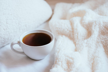 Cup of coffee in bed