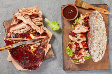 giant BBQ rib sandwich on board