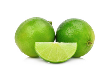 whole and slice fresh green lime isolated on white background
