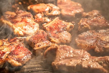 Meat is cooking on a grill. Meat background