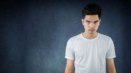 Portrait Handsome young asia man wearing a white shirt doing looking isolated on black background. Businessman concept. Asia people.