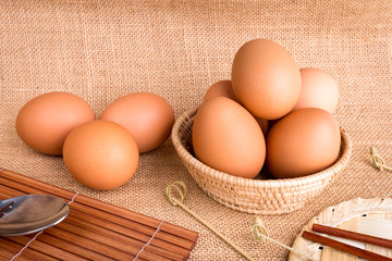 Set Eggs in a basket on  gunny (sackcloth)  background