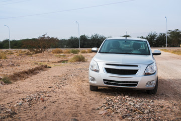 Fototapeta na wymiar Car in the desetr in Jordan in a day