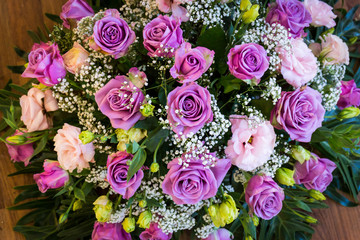 bouquet of roses on wood table