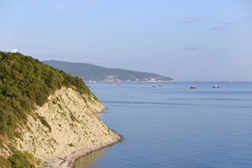 Fototapeta na wymiar A beautiful and rocky shore in the sea, in the city of Novorossiysk