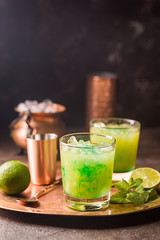 Orange cocktail decorated with lime