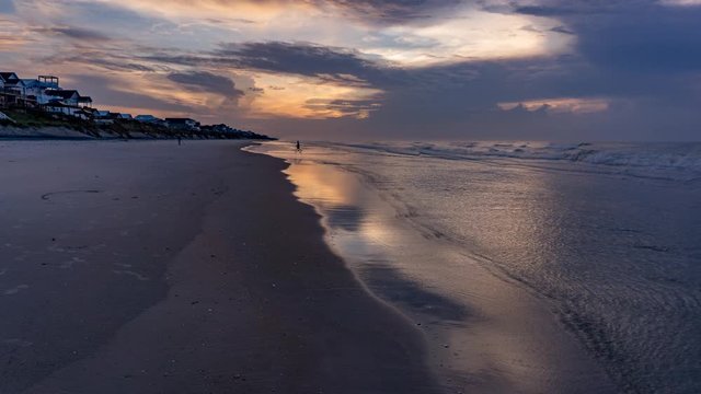 Cinemagraph of a calm and peaceful beach scene at the first light of dawn in an infinite and seemless loop