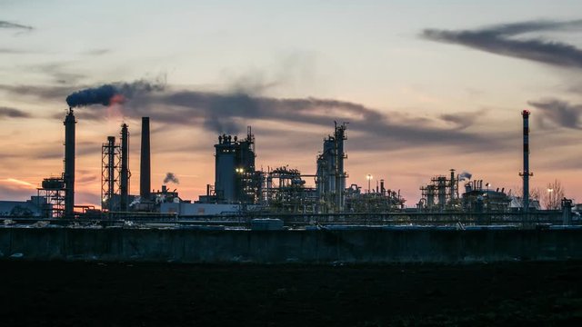 Oil Industry at night, Petrechemical plant -  Refinery, Time lapse sunset