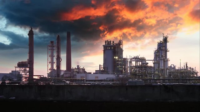 Oil Industry silhouette, Petrechemical plant - Refinery at sunset, Time lapse
