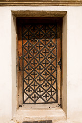 Wooden door with iron forging and handle