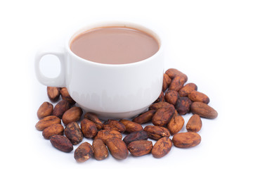 Cup of hot cocoa and cocoa beans isolated on white background
