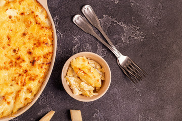 Mac and cheese, american style macaroni pasta in cheesy sauce.