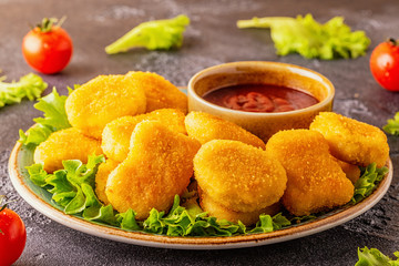 Chicken breast nuggets with sauces.