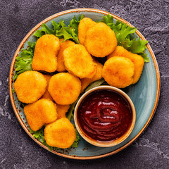Chicken breast nuggets with sauces.