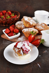 Strawberry cupcake with vanilla milk cream. Selective focus.