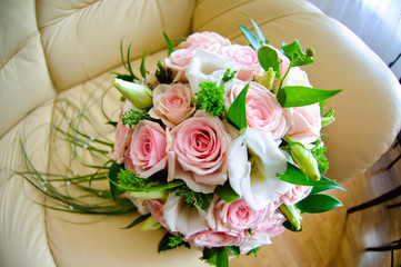 A bouquet of the bride with pink roses.