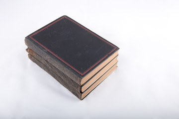 High angle  view of ancient books on white surface