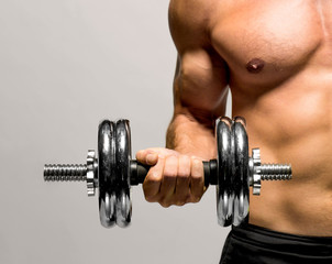 Fototapeta na wymiar powerful muscular man lifting weights 