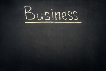 Obraz premium Business underlined inscription on dark chalkboard