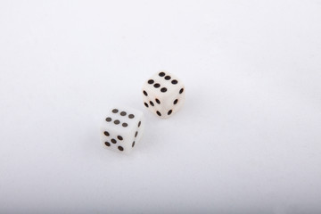 Two old white dice. Isolated on white background.