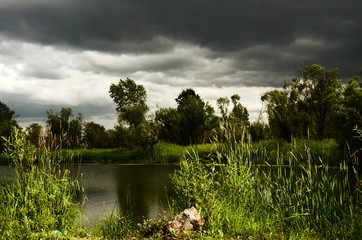 Lake before the storm. Storm clouds.
