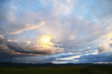 Obraz na płótnie Canvas Blue sky with blue clouds at sunset.