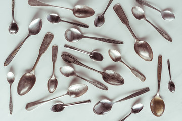 Vintage metal spoons on white background - Powered by Adobe