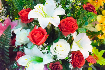 Rose fake flower and Floral background. rose flowers made of fabric. The fabric flowers bouquet. Colorful of decoration artificial flower