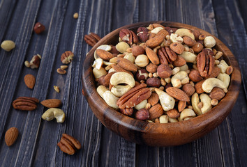 Nuts mix in a wooden plate